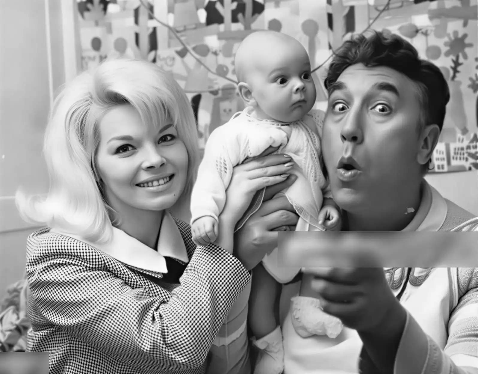 Marion Spence shows off nine week old daughter Sarah to comedian Frankie Howard. Marion Spence shows off nine week old daughter Sarah to comedian Frankie Howard.